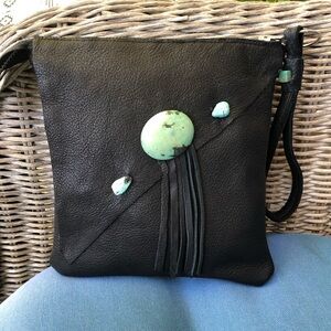 Sassy Black Leather bag withTurquoise stone and accents w/ matched lining,